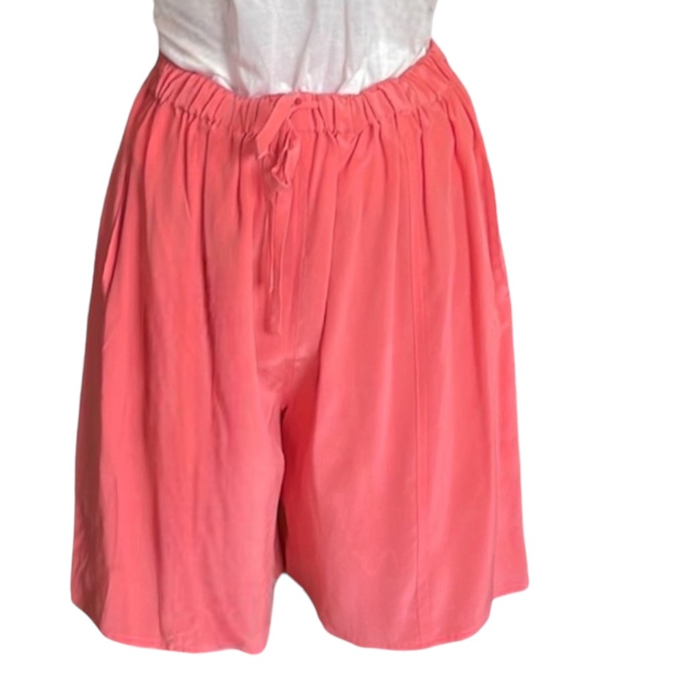 Pinkish Orange silk relaxed fit shorts.